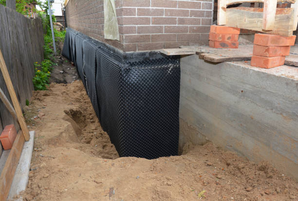 SJ Waterproofing Pros technician performing targeted Waterproofing assessment in Warners, NY
